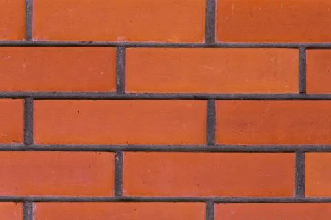 Red brick wall background clean with gray cement lines pattern Stock Photos