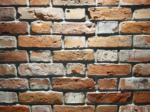 Red brick wall background. Close-up texture of red stone blocks Stock Photos