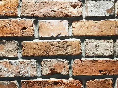 Red brick wall background. Close-up texture of red stone blocks Stock Photos