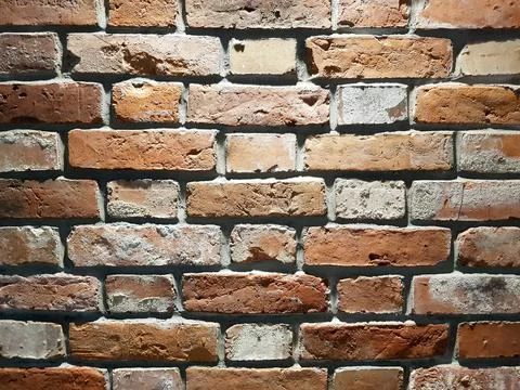 Red brick wall background. Close-up texture of red stone blocks Stock Photos
