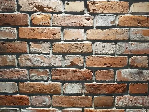 Red brick wall background. Close-up texture of red stone blocks Stock Photos