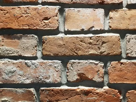 Red brick wall background. Close-up texture of red stone blocks Stock Photos