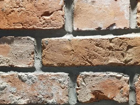 Red brick wall background. Close-up texture of red stone blocks Stock Photos