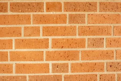 Red brick wall as background with large white joints Stock-Fotos