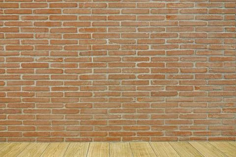 Red brick wall background with light brown wooden floor surface Stock Photos