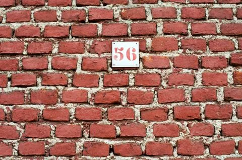 Red brick wall background with number 56 Stock Photos