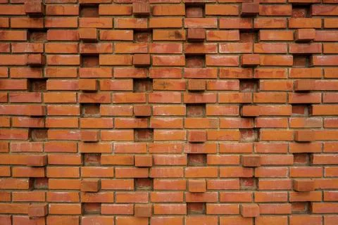 Red brick wall background of old brick houses lined up. Stock Photos