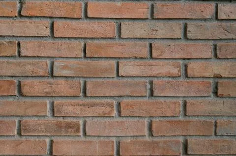 Red brick wall background with old textured bricks and cement structure Foto stock