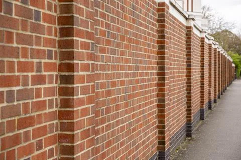 Red brick wall background outside of the building, London, UK. Stock Photos