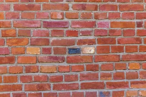 Red brick wall background with repeating horizontal masonry patterns. Texture Stock Photos