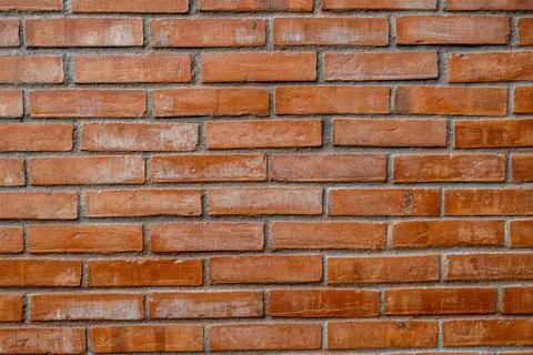 Red Brick Wall Background Showcasing Rustic Texture with Symmetrical Patter.. Stock Photos