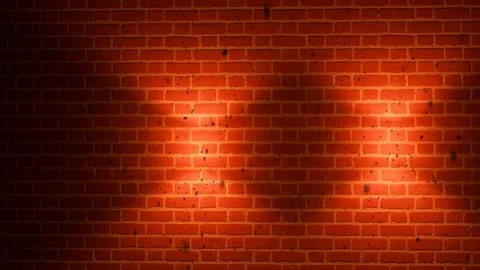 Red Brick Wall Background with Two Bright Spotlight Beams Stock Footage 331049625