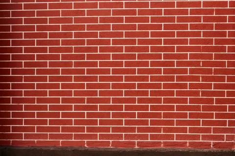 Red brick wall background with white grout lines. Texture of a classic red .. Stock Photos