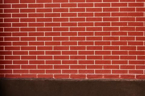 Red brick wall background with white grout lines. Texture of a classic red .. Stock Photos