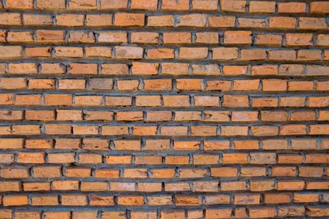 Red brick wall with cement in between Stock Photos