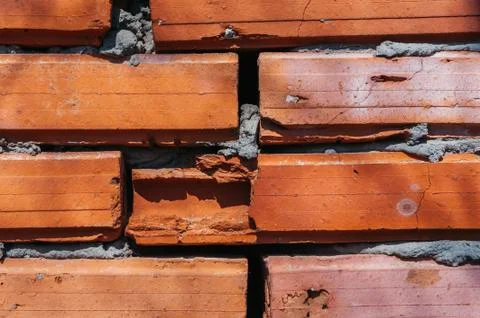 Red brick wall with cement Stock Photos
