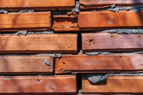 Red brick wall with cement Stock Photos