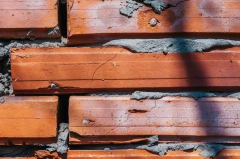 Red brick wall with cement Stock Photos