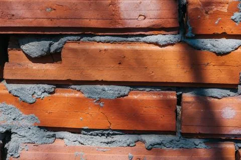 Red brick wall with cement Stock Photos