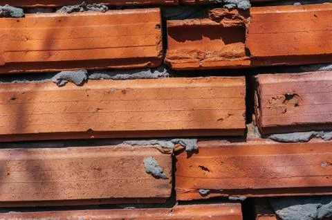 Red brick wall with cement Stock Photos