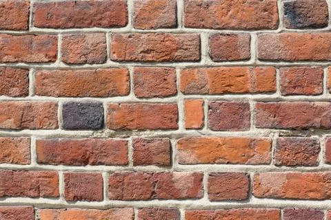 Red brick wall close up. Old ancient architecture background. Building wall s Stock Photos