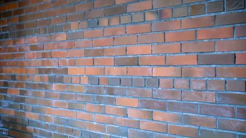 Red brick wall displaying a repeating pattern and rough texture for constru.. Stock Photos