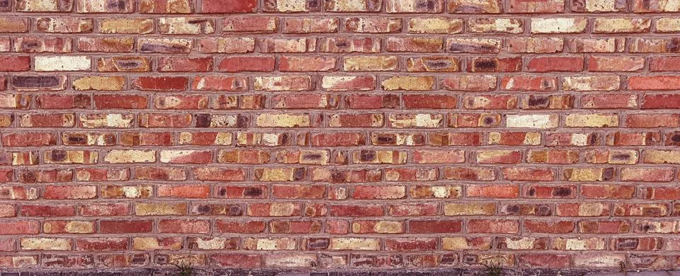 Red brick wall displaying rustic textured surface Stock Photos