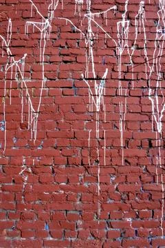 Red brick wall drenched in white paint, grunge Stock Photos