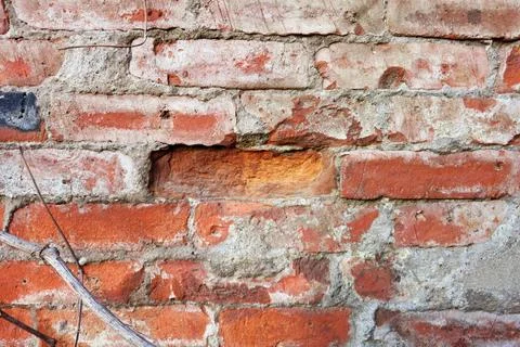 Red brick wall, dropped one brick Stock Photos