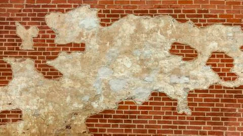 Red brick wall with elements of collapse 库存照片