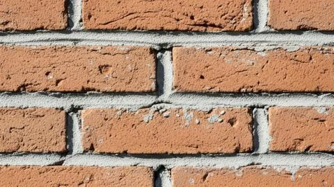 Red brick wall with gray mortar Stock Photos