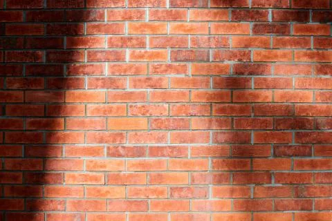 Red brick wall of loft building, red grunge brick wall background, loft textu Stockfoto's
