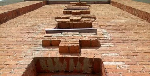 Red brick wall of the old fire tower Stock Photos