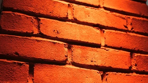 Red brick wall orange light dynamic Stock Footage 97095436