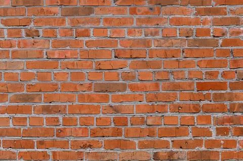 Red brick wall presents abstract background for modern creative banner. Stock Photos