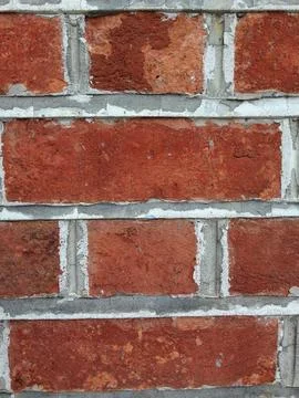 Red brick wall with rough aged texture Stock-Fotos