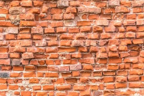 Red brick wall of ruins texture facade Stock Photos