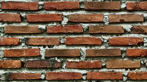 Red brick wall seamless loop stop motion animation with rough texture. Video stock 334632729