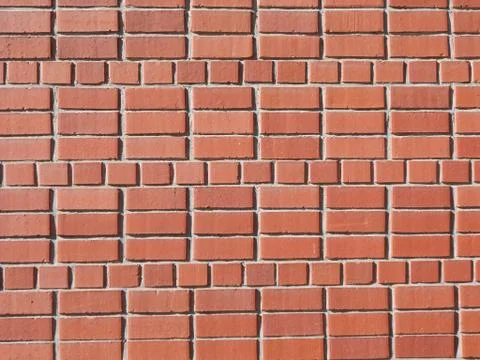 A red brick wall sidelit - as background Stock Photos