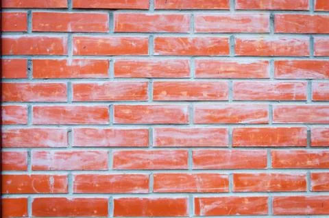 Red brick wall texture background of a house. Close up macro. Stock Photos