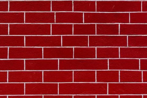 Red brick wall texture background. Bright structured stones with white stucco Stockfoto's