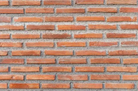 Red brick wall texture forming classic architectural background Stock Photos