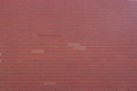 Red brick wall texture with grey cement filling Stock Photos