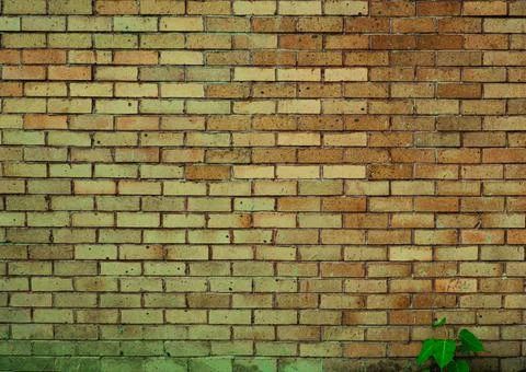 Red brick wall texture grunge background with vignette corners may be used in Stock Photos