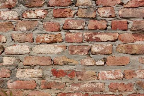 Red brick wall texture. Old rough orange brickwork background. Stock Photos