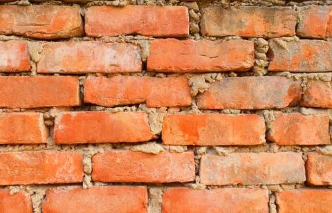 Red brick wall. Texture of old dark brown and red brick wall background.close up Stock Photos