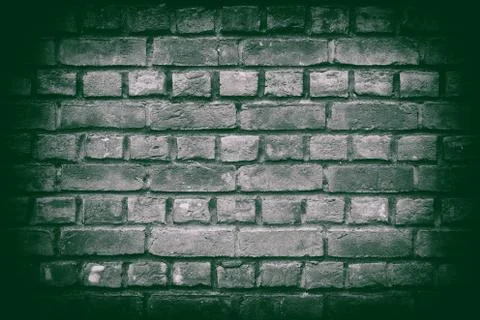 Red brick wall texture or background on green 写真素材