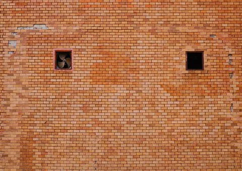 Red brick wall texture Retro weathered with pointed hole fan for interior dec Stock Photos
