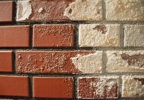 Red brick wall texture with white plaster detail background and copy space Foto stock