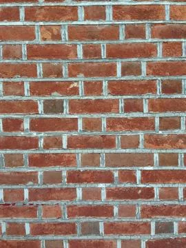 Red brick wall with uniform rectangular pattern Stock Photos